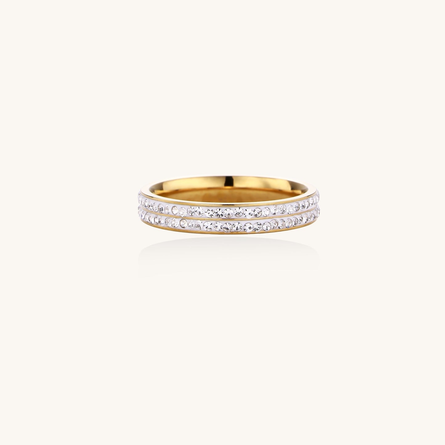 Gold-plated stainless steel ring with two parallel rows of rhinestones creating sparkling geometric bands.