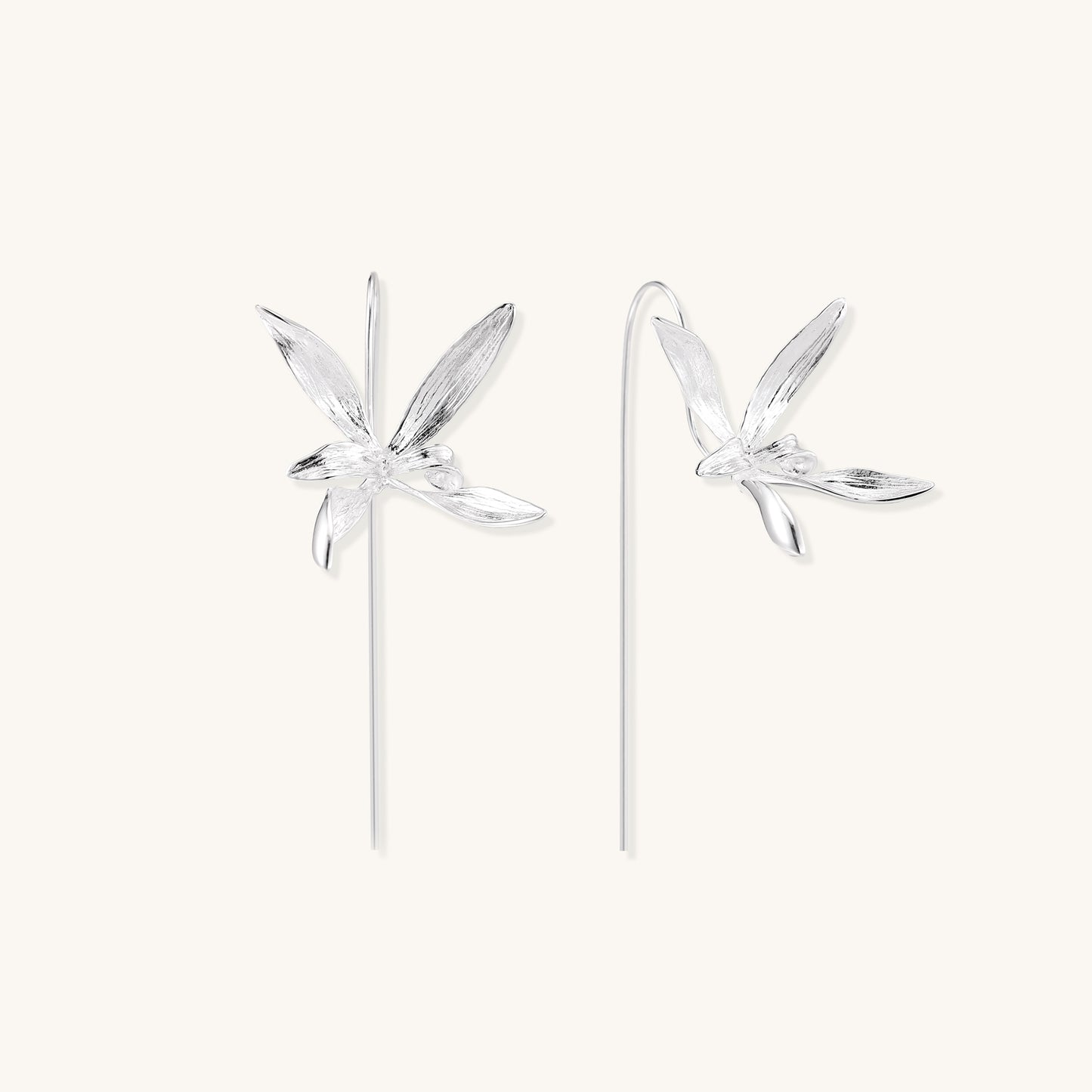 Delicate sterling silver flower earrings with long threader posts and five-petal design on white background.