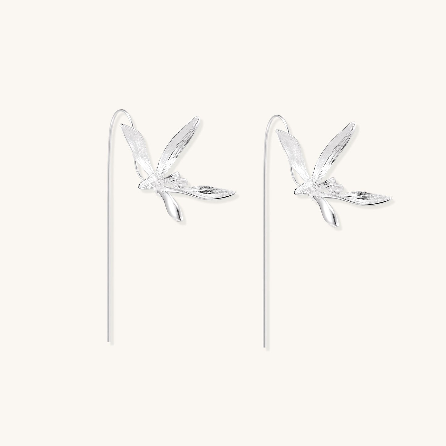Delicate sterling silver flower earrings with long threader posts and five-petal design on white background.
