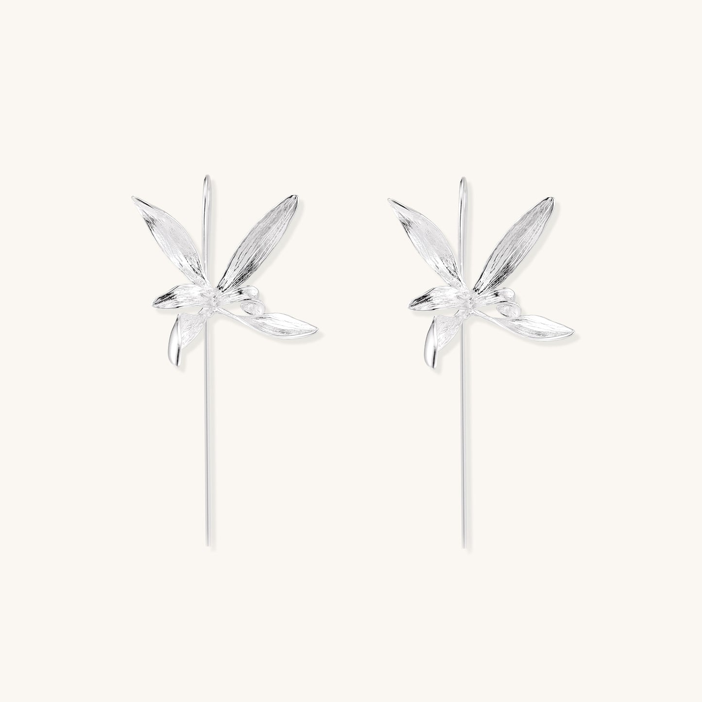 Delicate sterling silver flower earrings with long threader posts and five-petal design on white background.