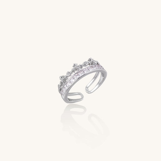 Adjustable gold-plated crown ring with zirconia crystals in ornate tiara design on white background.
