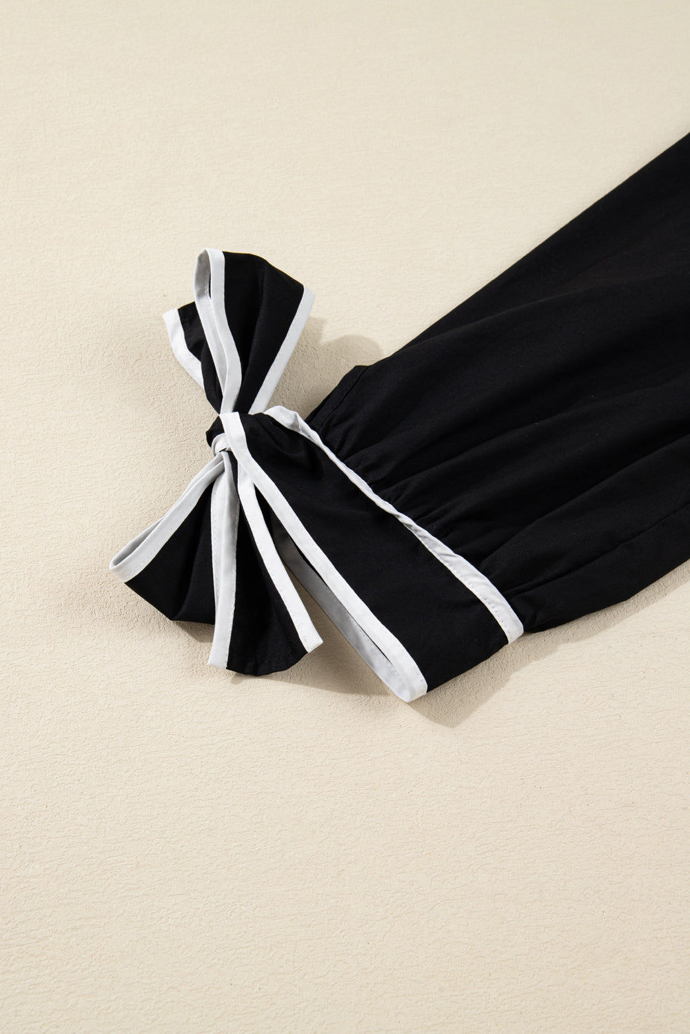 Black Contrast Trim Knot Cuffs Plus Size V Neck Mini Dress