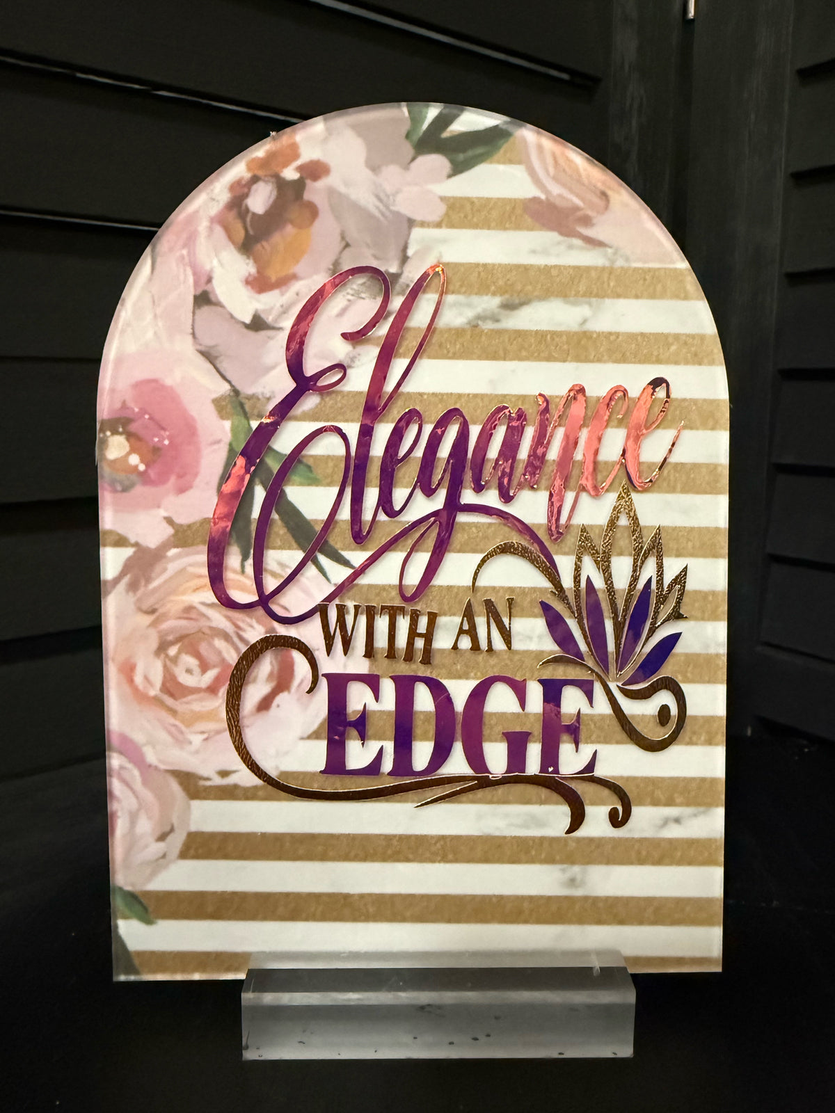 Elegance With an Edge arched acrylic plaque: blush peonies with gold and white marble stripes, iridescent foil script, gold and purple lotus, on a clear acrylic stand